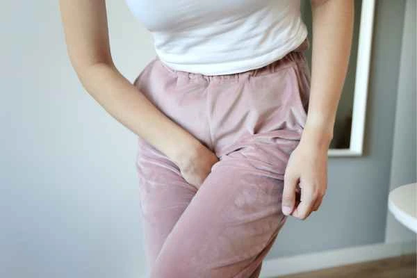 woman running for the toilet because of urinary incontinence Bishop's Stortford